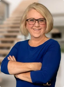 Professional portrait in blue dress and glasses